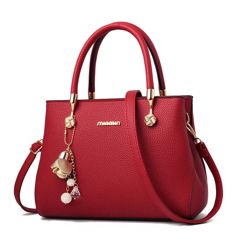 Elegant Red Leather Handbag for Women – Stylish & Versatile Purse with Charm